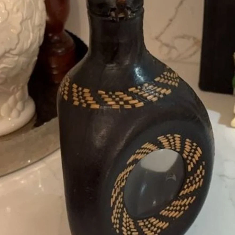 Vintage Hand-Carved Leather Wrapped Glass Decanter with Woven Detail